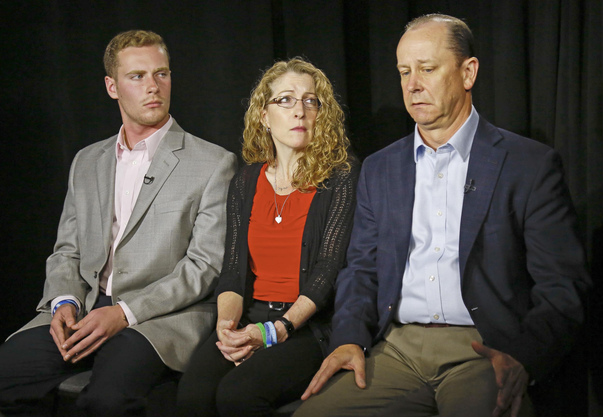 James Piazza, right, seated with his wife Evelyn and son Michael, holds back emotions while discussing the death of his son (AP/Bebeto Matthews)