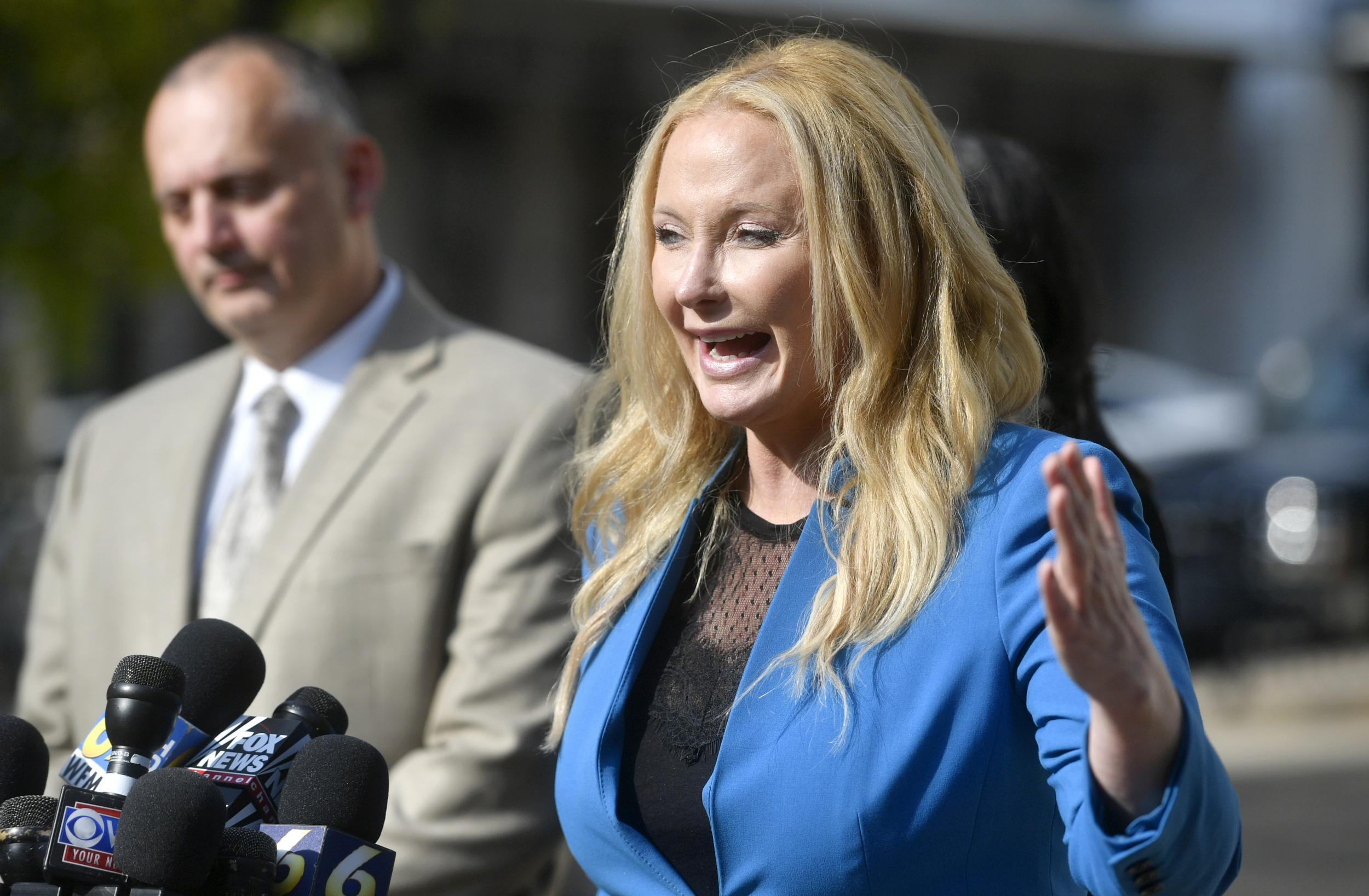 Ms Miller talks to the media after a day of the preliminary hearing for members of Beta Theta Pi charged in Piazza’s death (Centre Daily Times/AP)