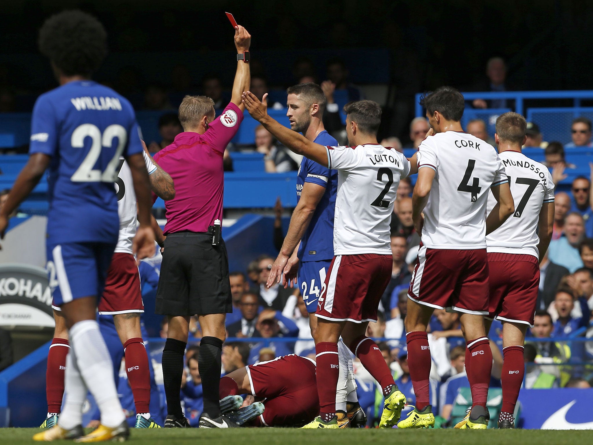 Gary Cahill is shown a straight red