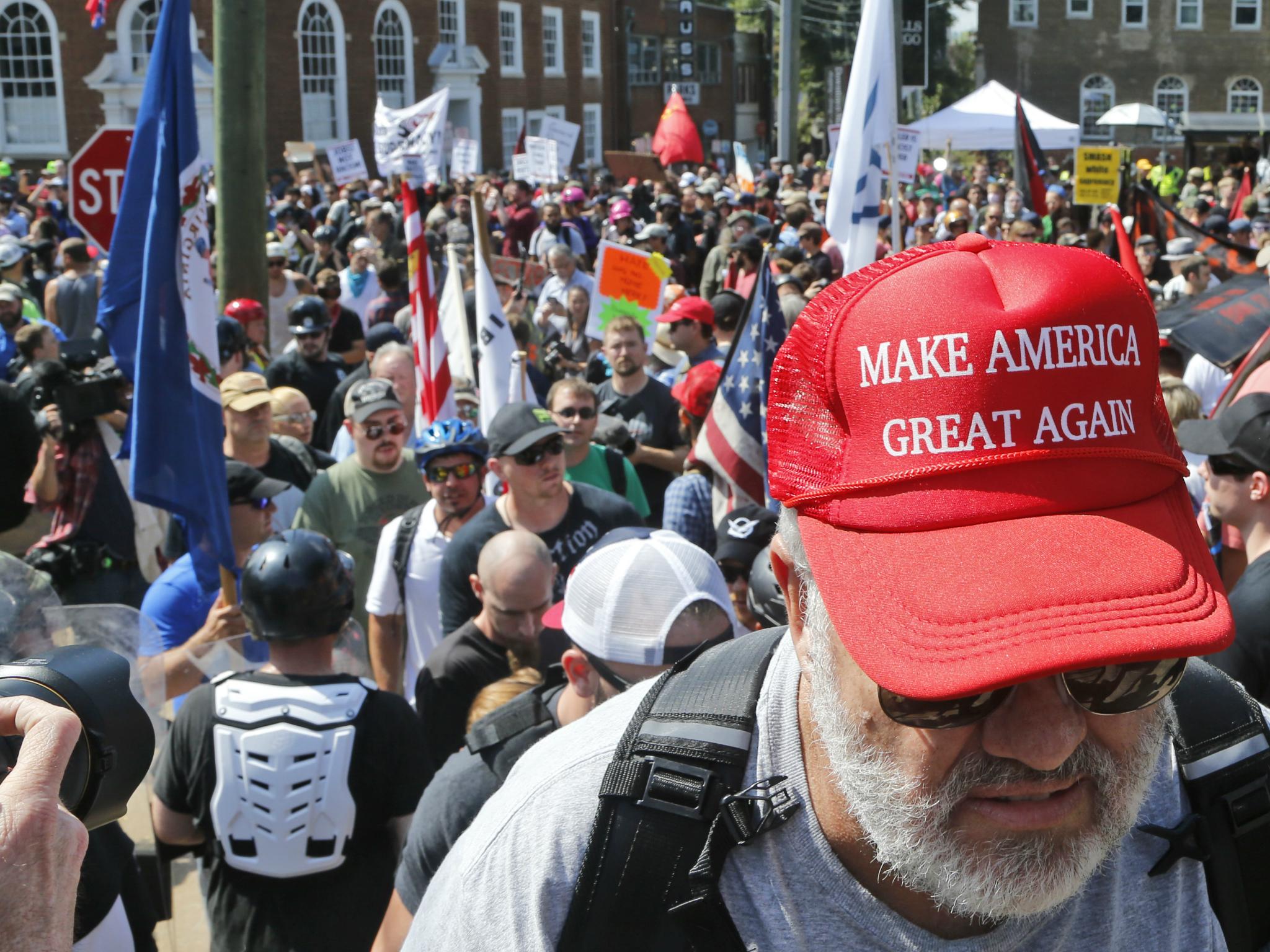 A white supremacist in Charlottesville proudly sporting a Trump campaign cap
