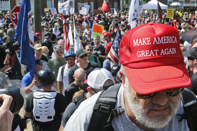 A white supremacist in Charlottesville proudly sporting a Trump campaign cap