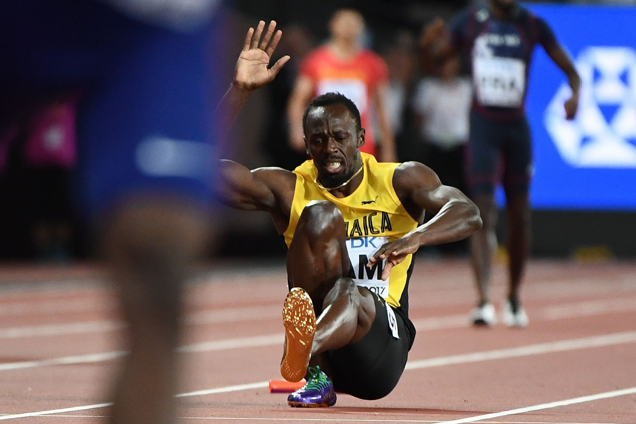 Usain Bolt crashed out of his final appearance as injury struck him down in the 4x100m men's relay