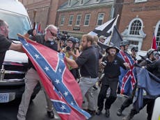 Organiser of Charlottesville far-right protest chased away by crowd