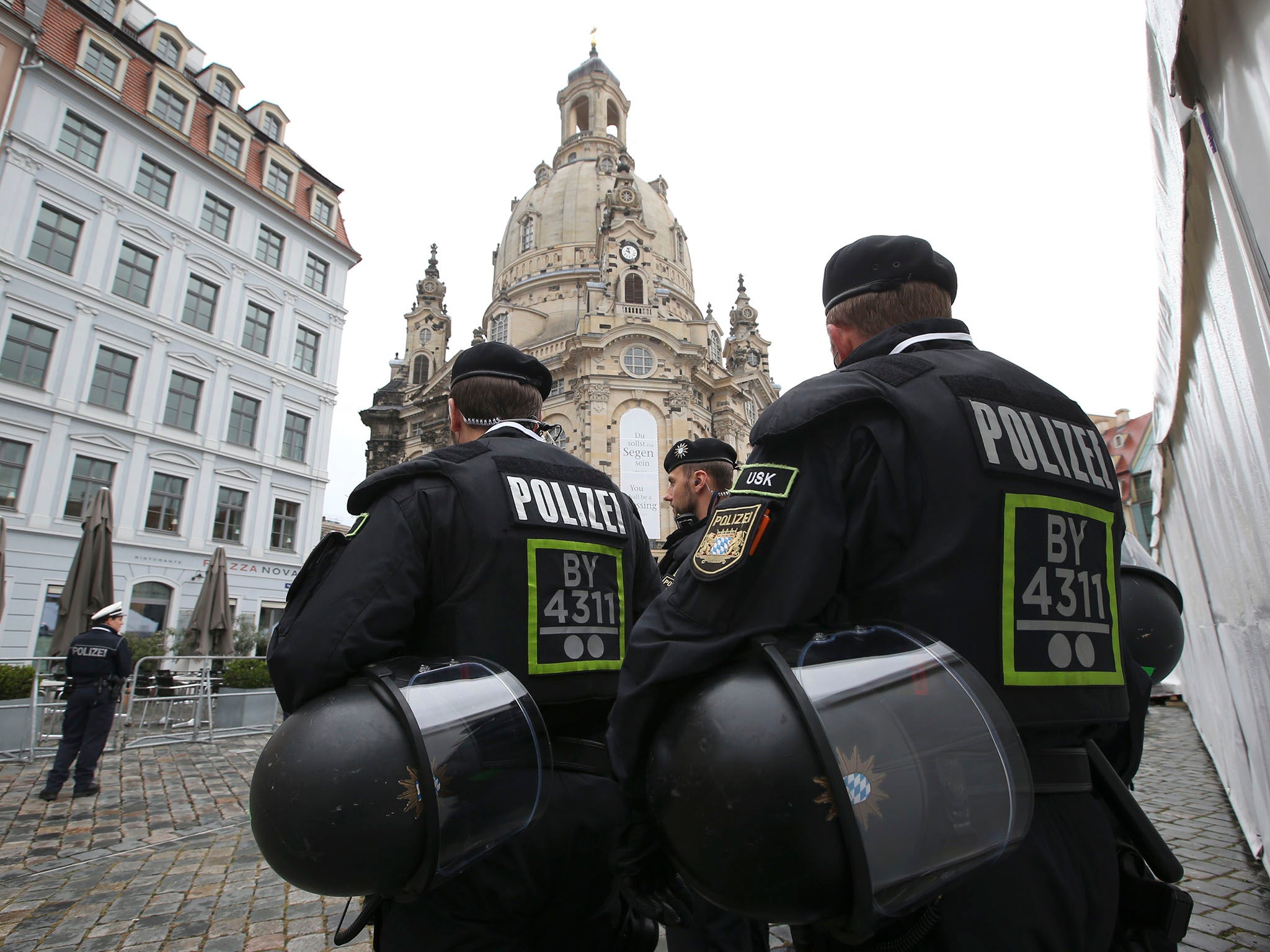 German police in front of the Frauenkirche cathedral in Dresden, where the incident took place