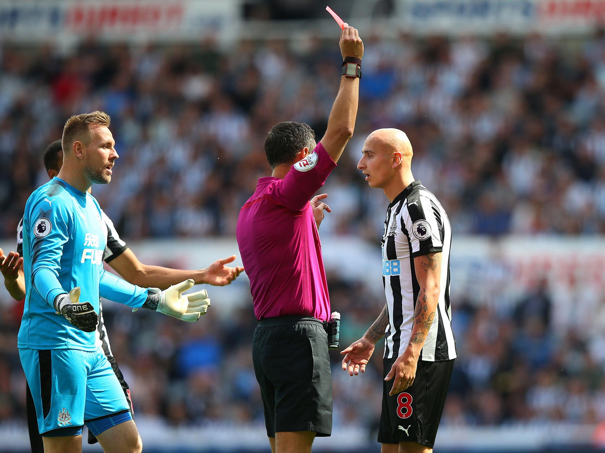 Jonjo Shelvey is shown a red card for stamping on Dele Alli