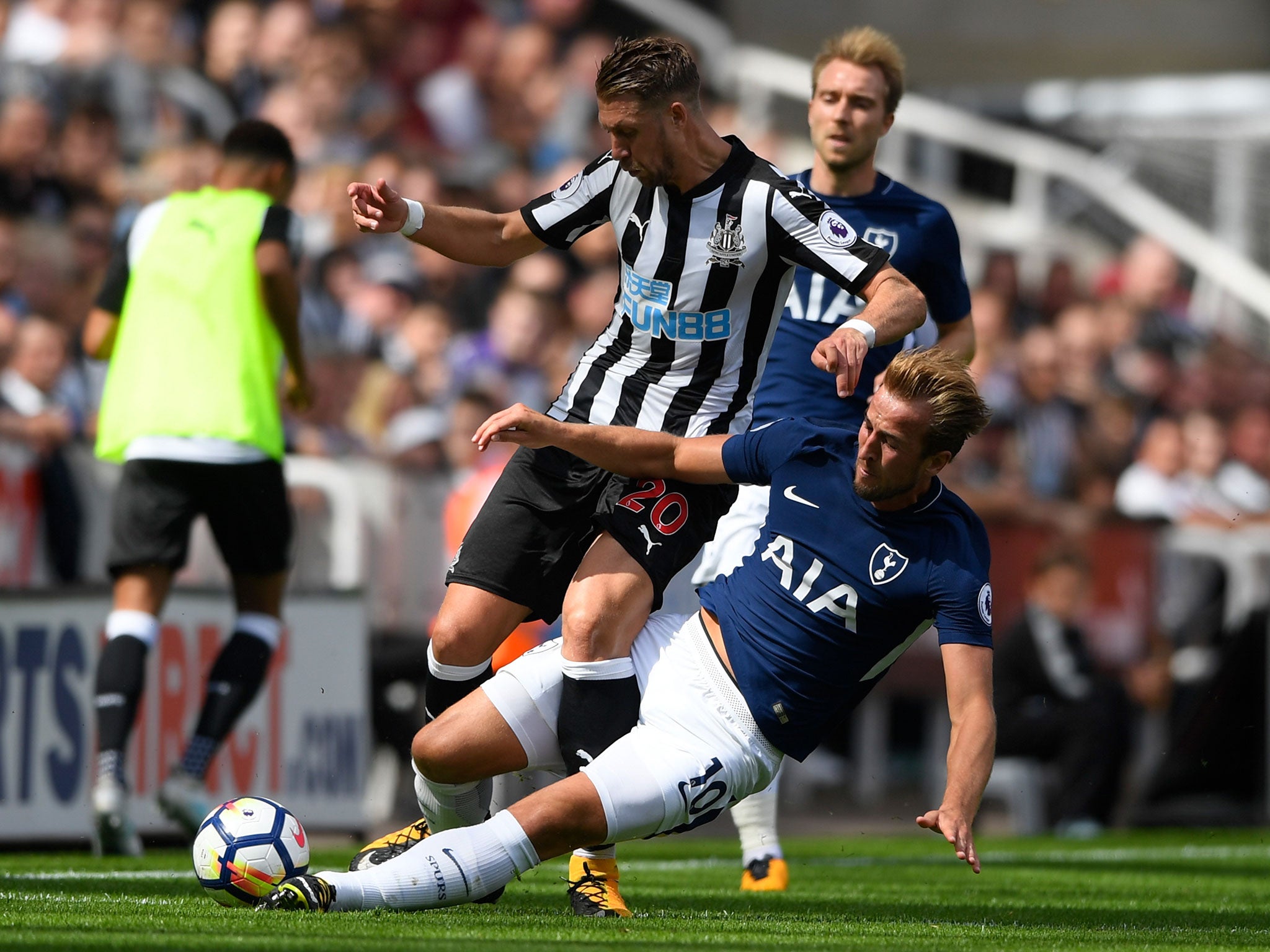 Harry Kane was shown a yellow card for his rash challenge on Newcastle debutant Florian Lejeune