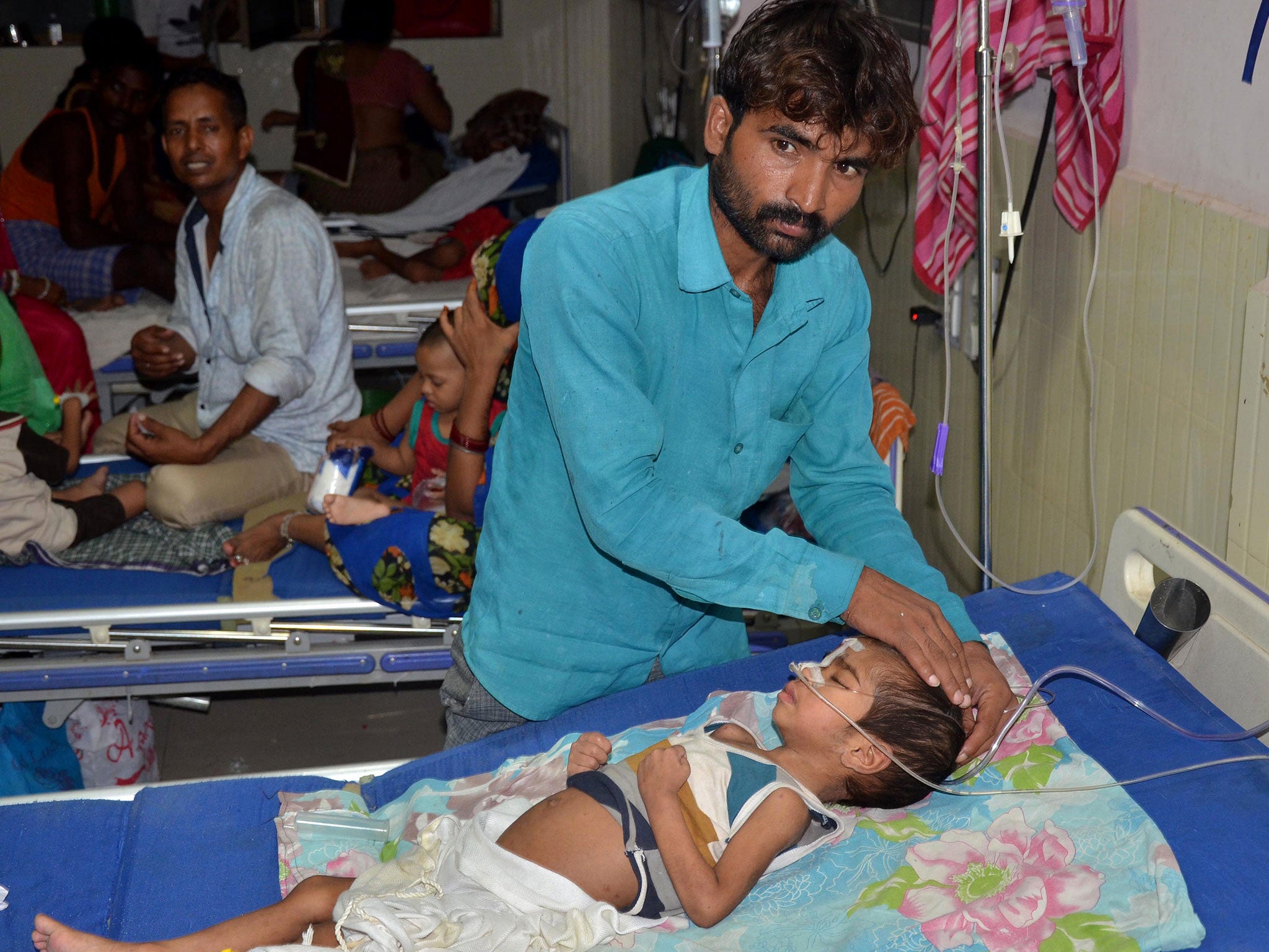 Family members care for children undergoing treatment at the hospital in Gorakhpur