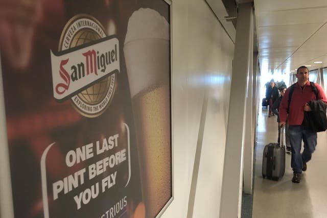 Last orders: an advert at Stansted airport departures area urges passengers to enjoy ‘one last pint before you fly’
