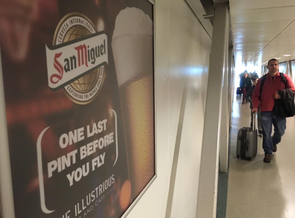 Last orders: an advert at Stansted airport departures area urges passengers to enjoy ‘one last pint before you fly’