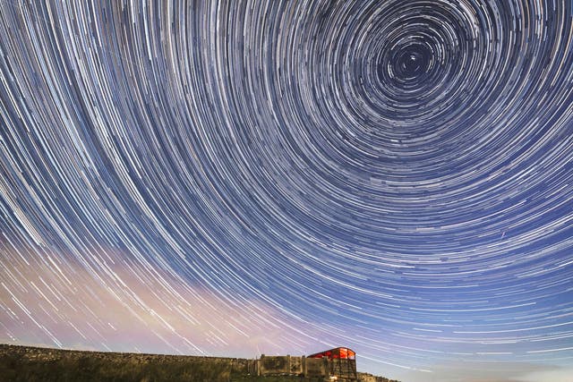 A digital composite of 233 photographs taken over a period of nearly two hours shows meteors and star trails during the Perseid meteor shower seen in the Yorkshire Dales National Park.
