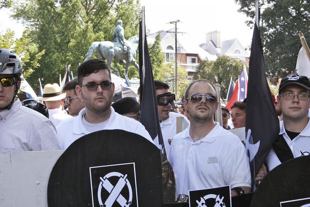 James Fields, second from left, was pictured holding a black shield in Charlottesville hours before he drove a car into a group of anti-fascist protesters