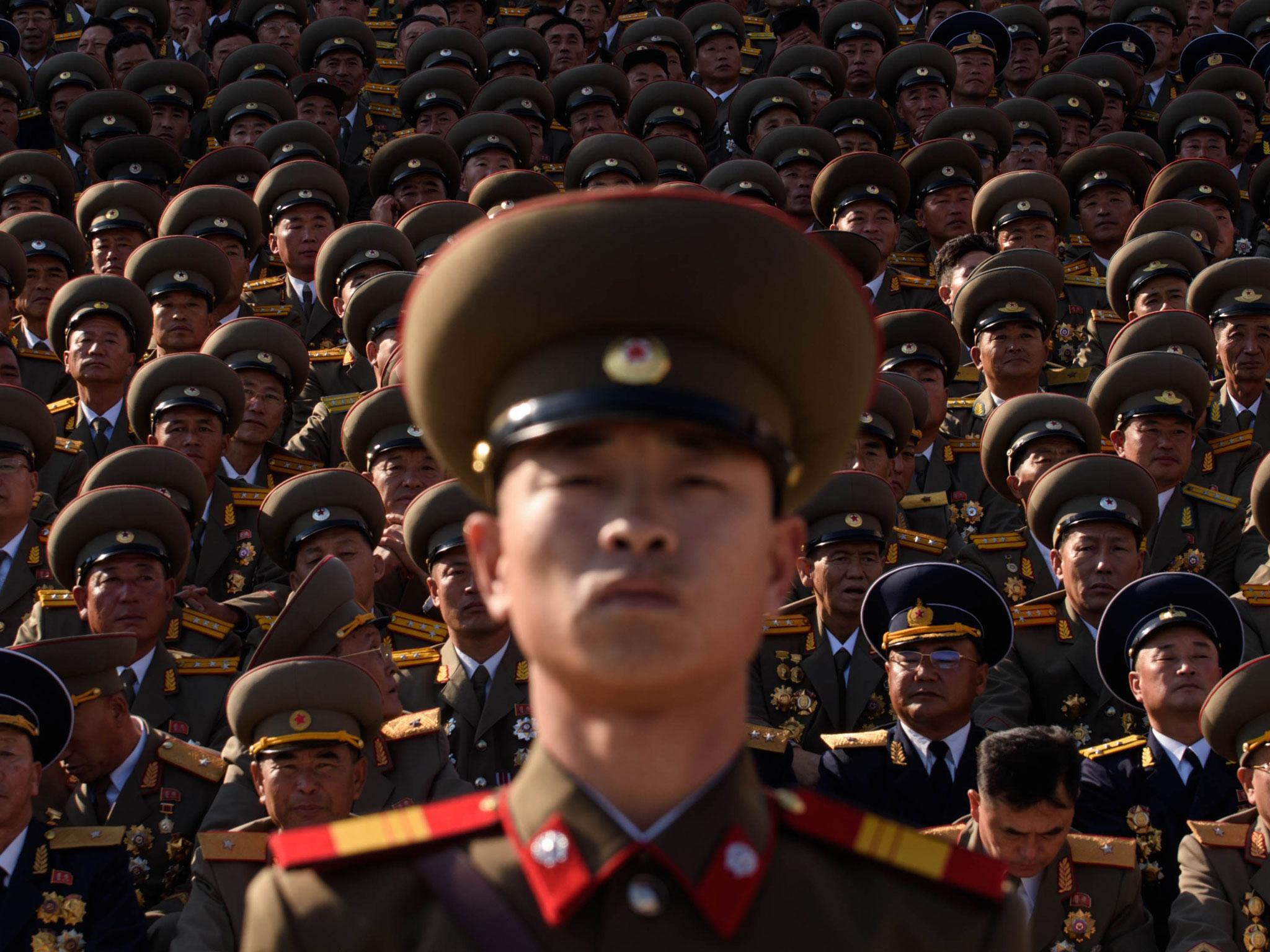A North Korean soldiers stands before spectators during a mass military parade at Kim Il-Sung square in Pyongyang