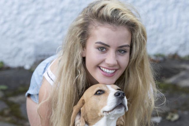 Chloe Ayling at home in Coulsdon in Surrey with dog Nialla after her kidnap ordeal in Milan