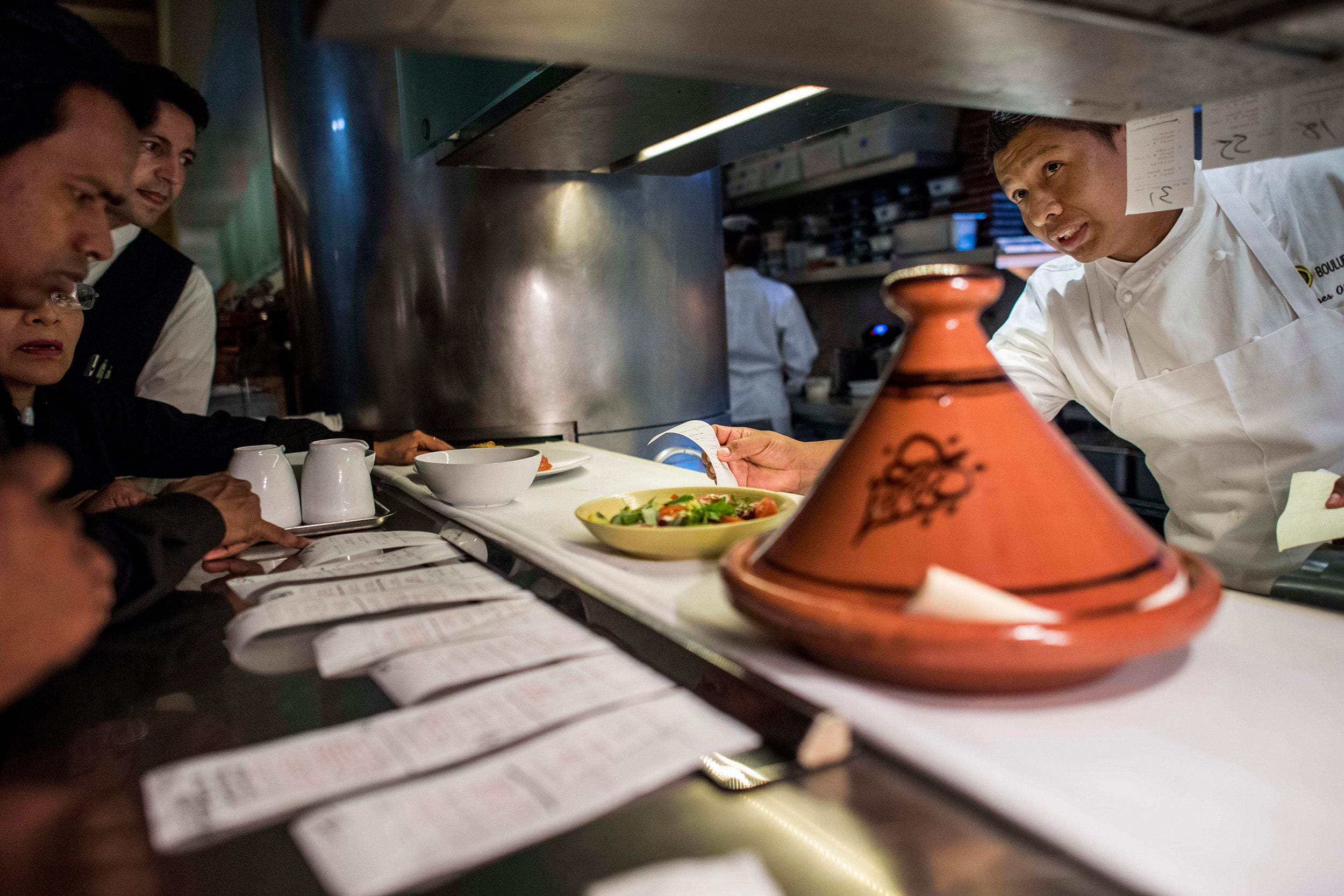 Ulises Olmos, an executive sous chef, works the line during dinner service at Boulud Sud in Manhattan. Olmos began as a pot washer at Cafe Boulud in 2005