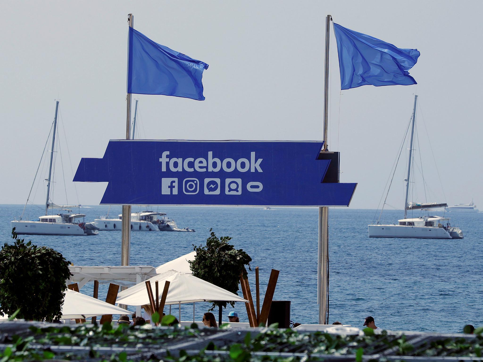 The logo of the social network Facebook is seen on a beach during the Cannes Lions in Cannes, France, June 21, 2017