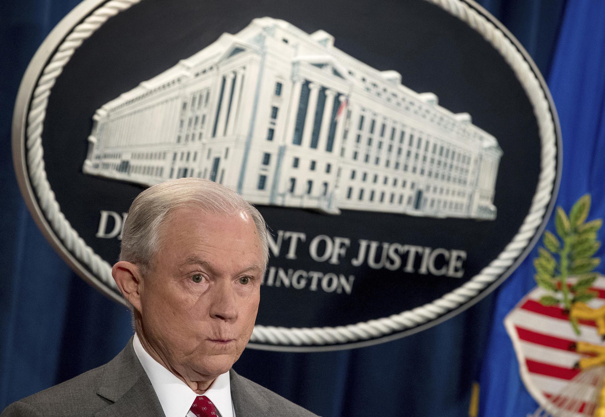 Attorney General Jeff Sessions attends a news conference at the Justice Department