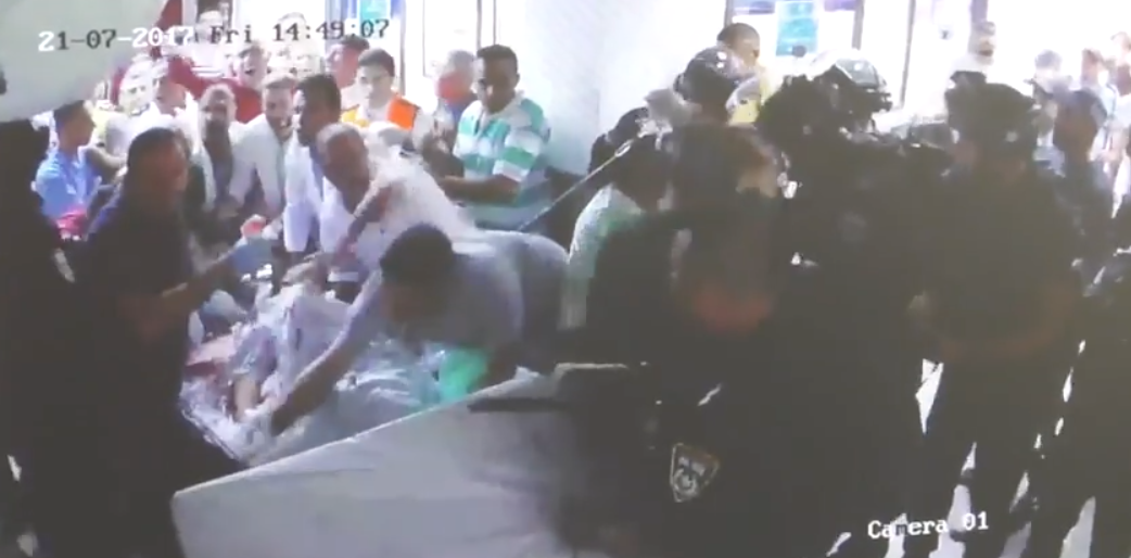 The security forces shoved staff aside to grab the stretcher injured 20-year-old Muhammed Abu Ghanam is lying on, preventing doctors from taking him to the operating theatre