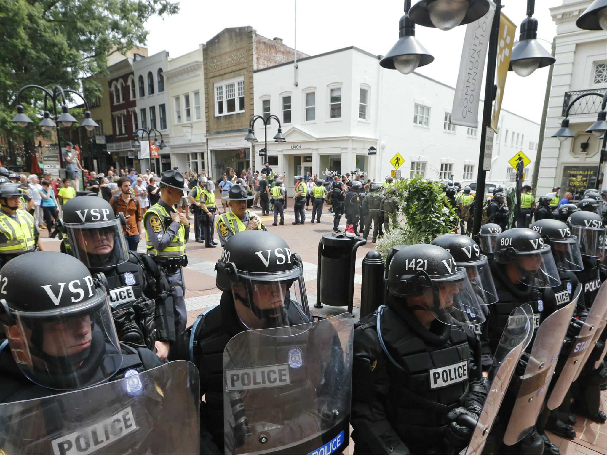 Virginia State Police cordon off an area around the site of several clashes between white supremacists and counter-protesters which resulted in the death a protester, two state police officers, and several injuries