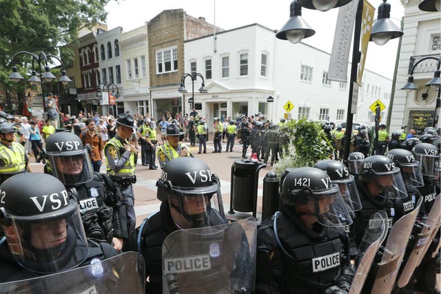 Virginia State Police cordon off an area around the site of several clashes between white supremacists and counter-protesters which resulted in the death a protester, two state police officers, and several injuries
