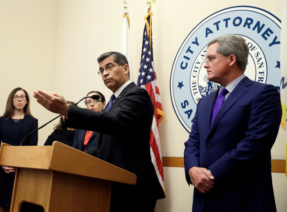 California Attorney General Xavier Becerra and San Francisco City Attorney Dennis Herrera discuss suing the Trump administration over its immigration policies on Monday, Aug. 14, 2017, in San Francisco