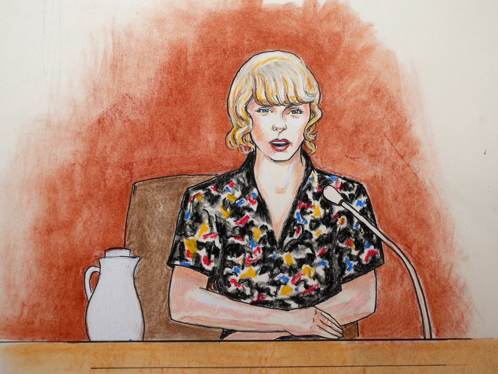 In this courtroom sketch, pop singer Taylor Swift speaks from the witness stand during