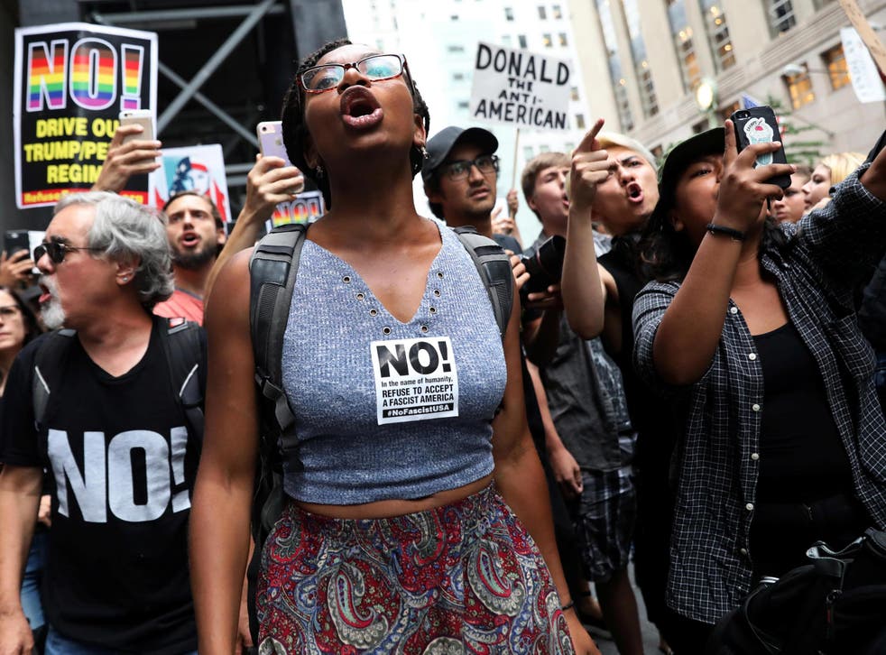 Anti-racism protesters shout during protests in front of Trump Tower in New York City
