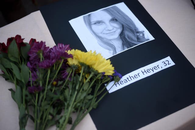 Flowers laid at a memorial for activist Heather Heyer, killed in anti-fascist clashes in Virginia