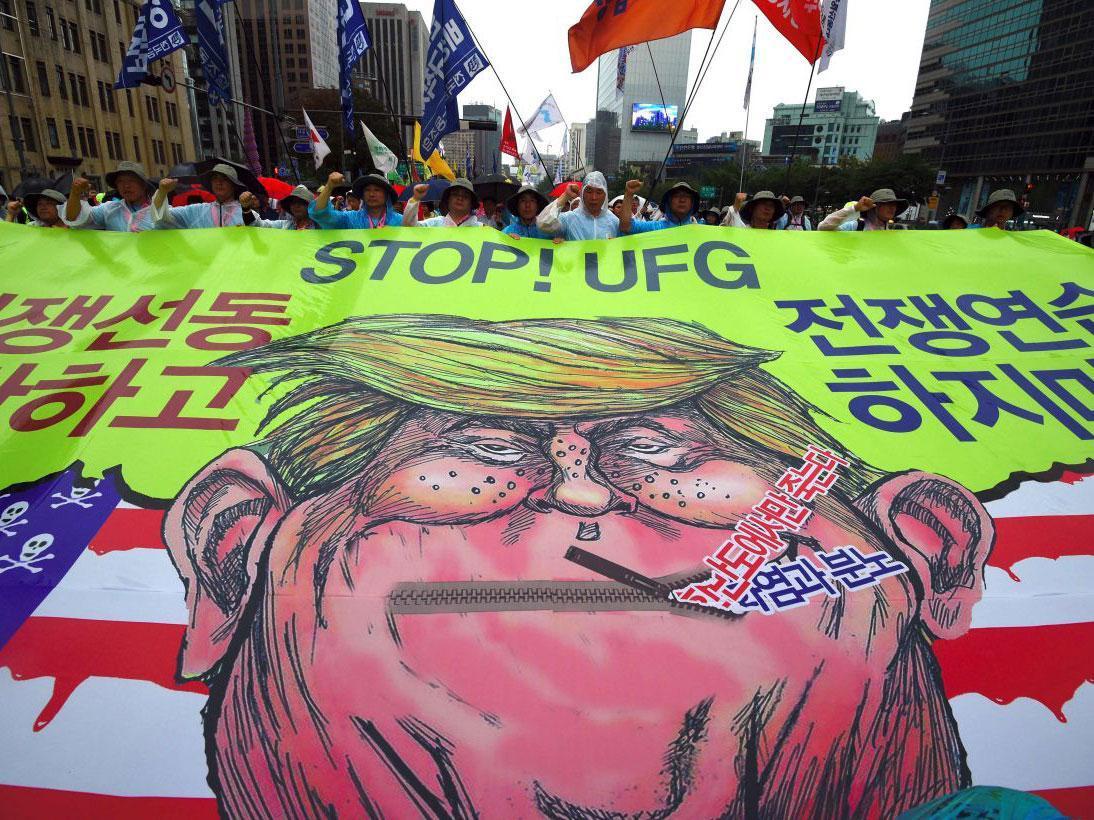 Protesters in South Korea at a peace rally, amid rising tensions on the peninsula