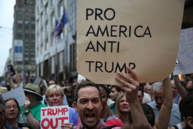 Anti-Trump activists demonstrate ahead the President’s arrival in Manhattan on Monday