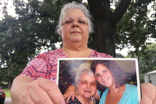 Heather Heyer's mum holds a picture of her daughter and her mother