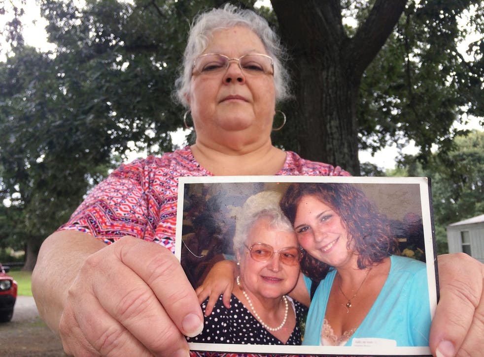 Heather Heyer's mum holds a picture of her daughter and her mother