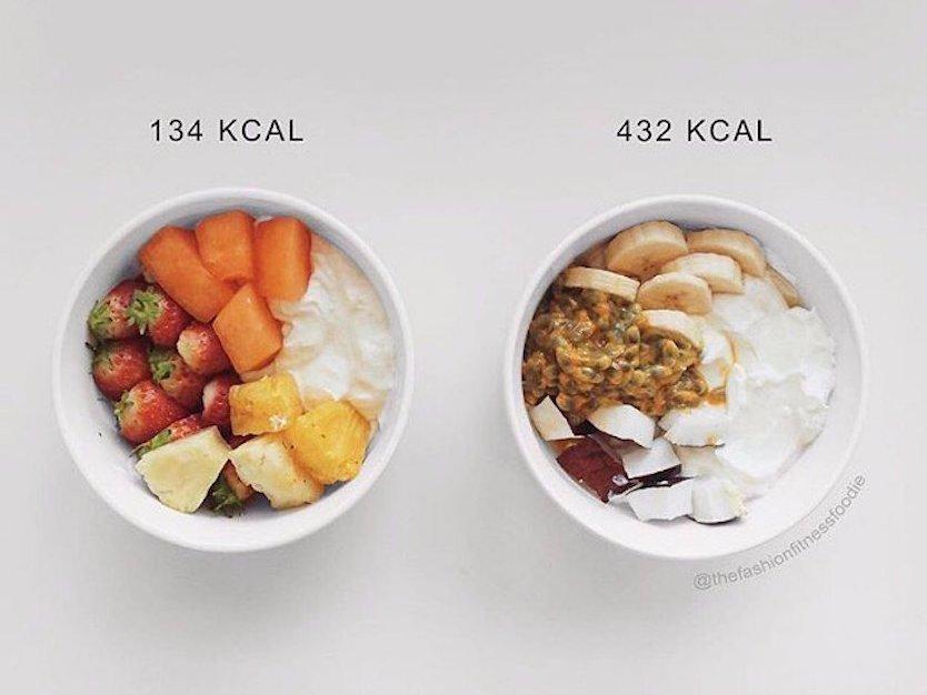 The bowl on the left has strawberries, melon, and pineapple, and the bowl on the right has banana, coconut, and passion fruit.