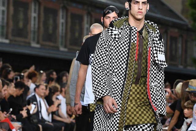 Givenchy adopted the optical grid with a collection overcharged with busy prints