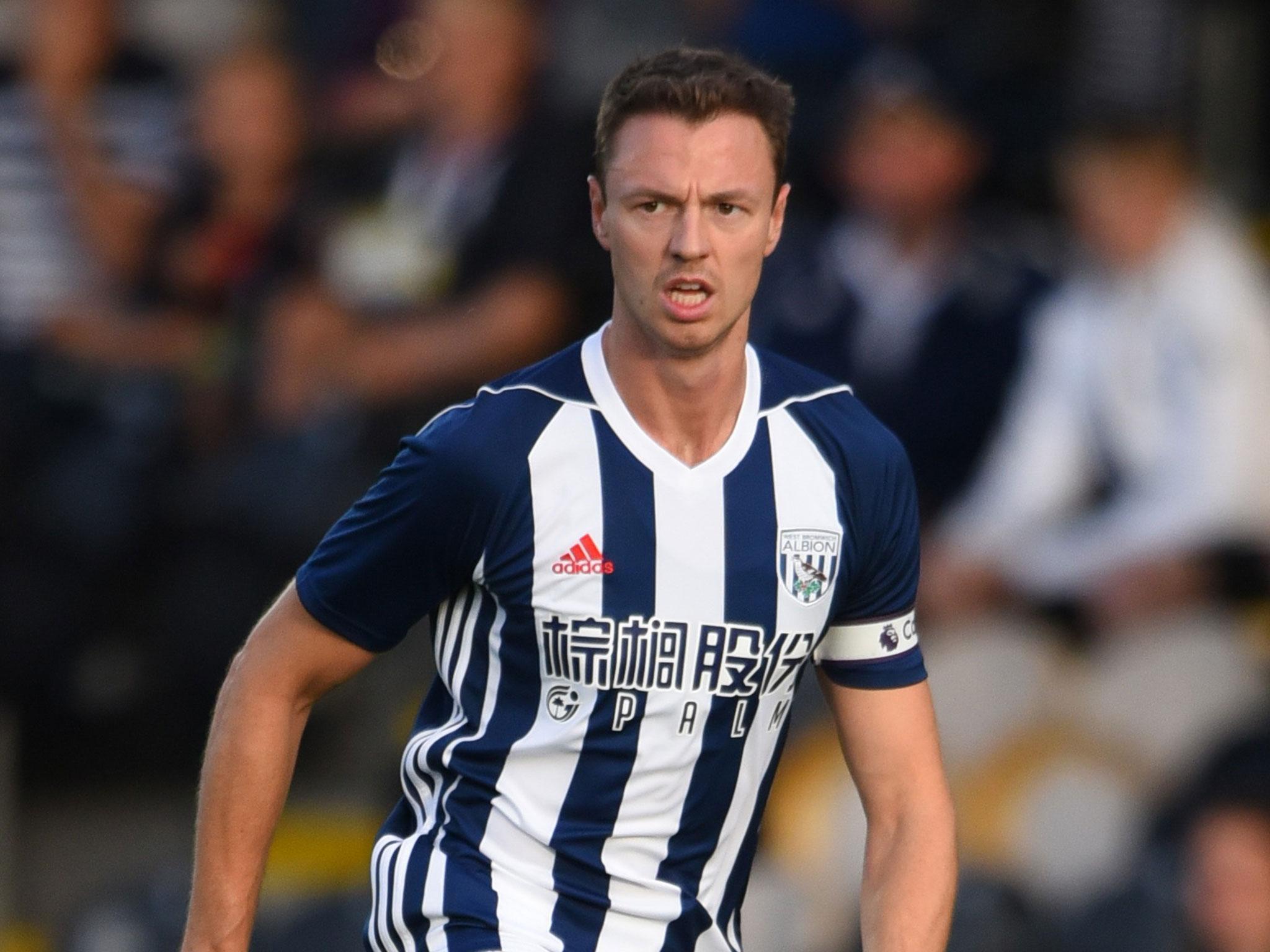 Jonny Evans is at the centre of a three-way battle for his signature