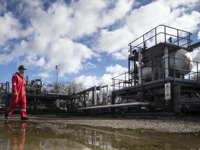 An engineer passes a fracking facility near Kirby Misperton in North Yorkshire
