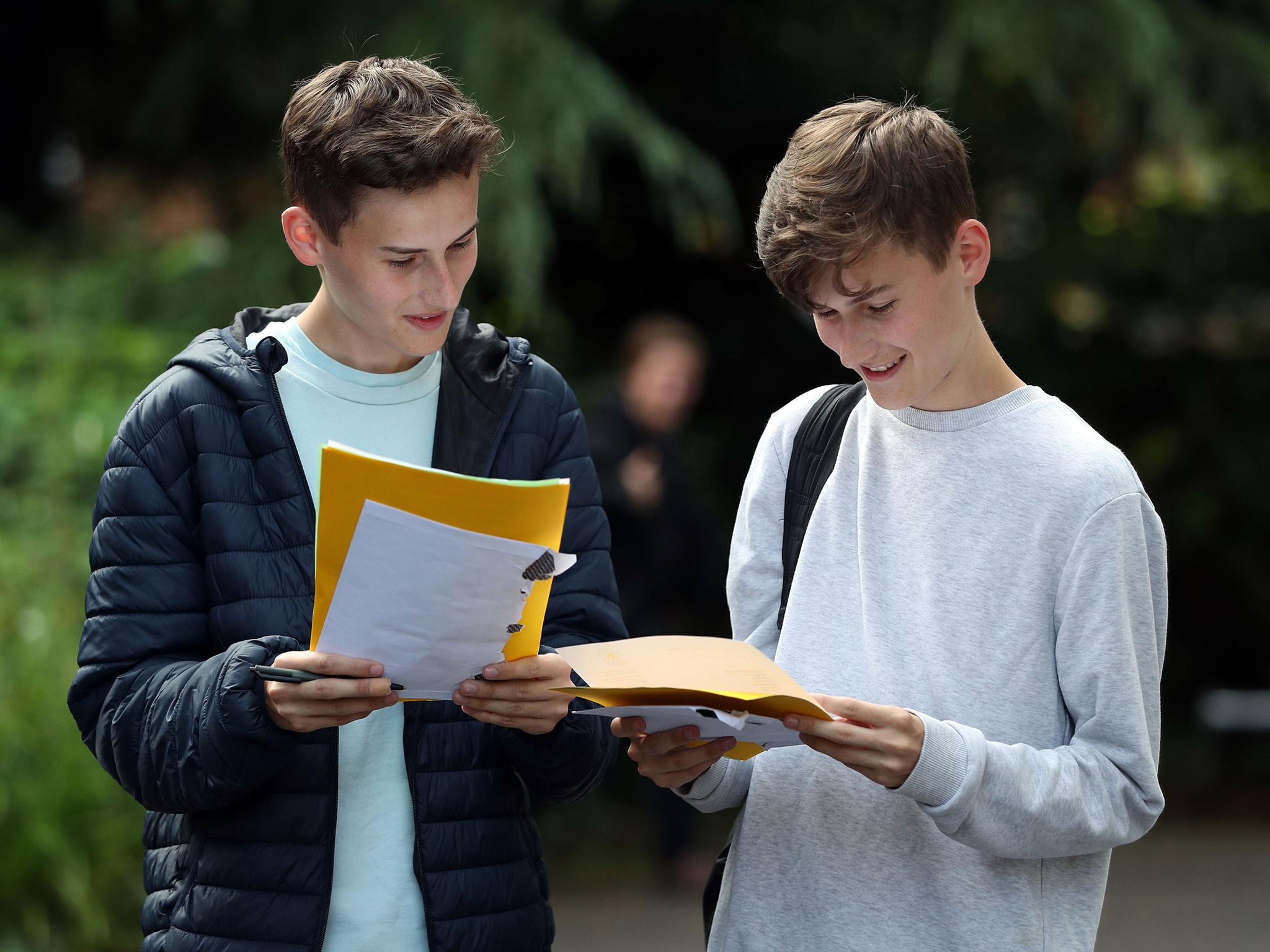 Twin Students James (left) and Toby Houston collect their A-level results at Peter Symonds college in Winchester, Hampshire