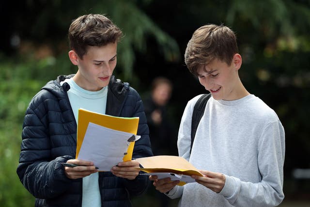 Twin Students James (left) and Toby Houston collect their A-level results at Peter Symonds college in Winchester, Hampshire