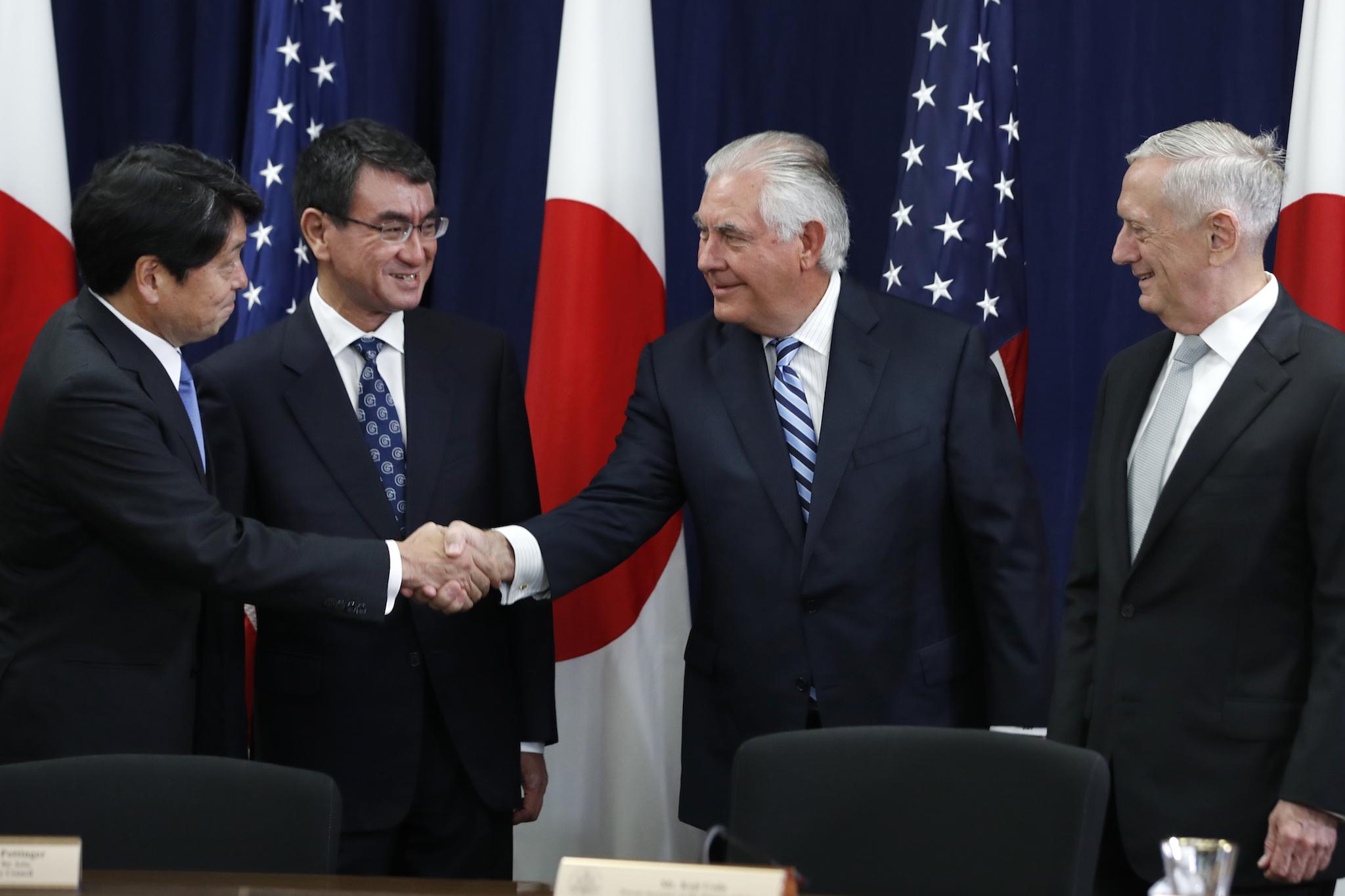 Japanese Defense Minister Itsunori Onodera, left, next to Japanese Foreign Minister Taro Kono, shakes hands with Secretary of State Rex Tillerson, next to Defense Secretary James Mattis