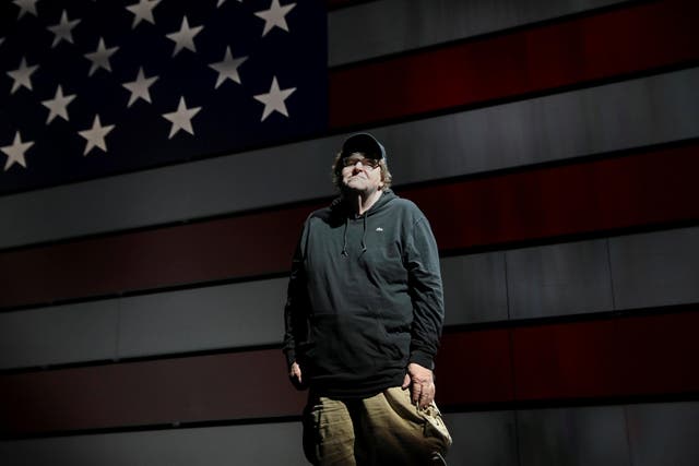 Michael Moore poses for a portrait at the site of his one-man Broadway show at the Belasco Theatre in Manhattan