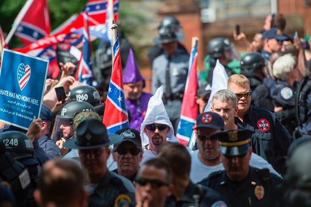 Protesters, including members of the Ku Klux Klan, protest against the removal of a Confederate statue on July 8, 2017