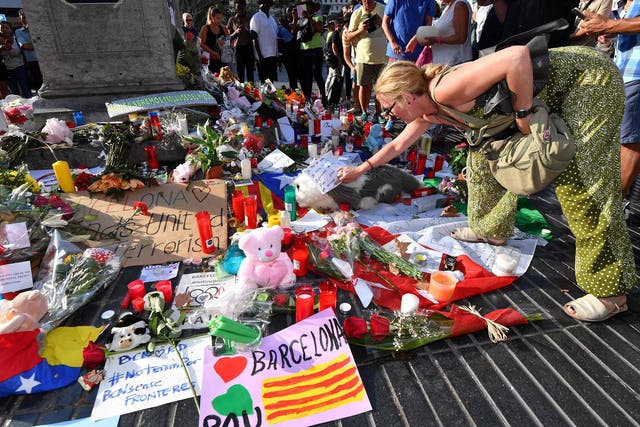 A woman pays tribute to those who lost their lives in the Barcelona terror attack