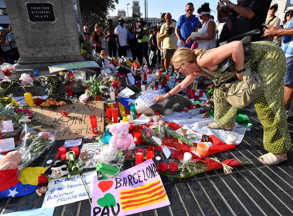 A woman pays tribute to those who lost their lives in the Barcelona terror attack
