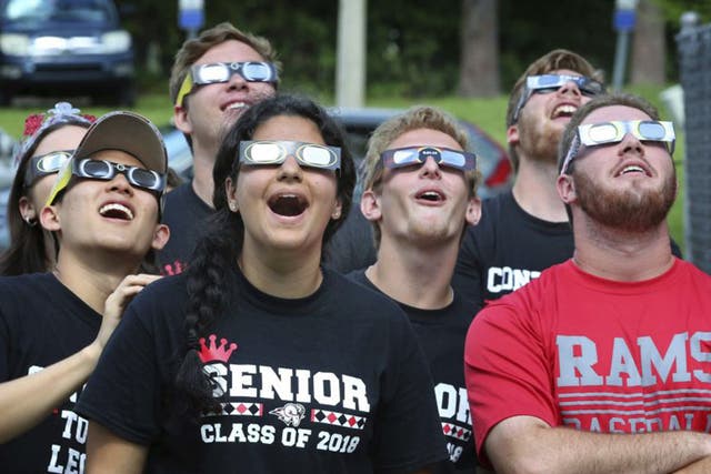 High School students using their eclipse glasses during a trial run yesterday