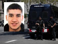 Barcelona van massacre driver 'is still on the run'