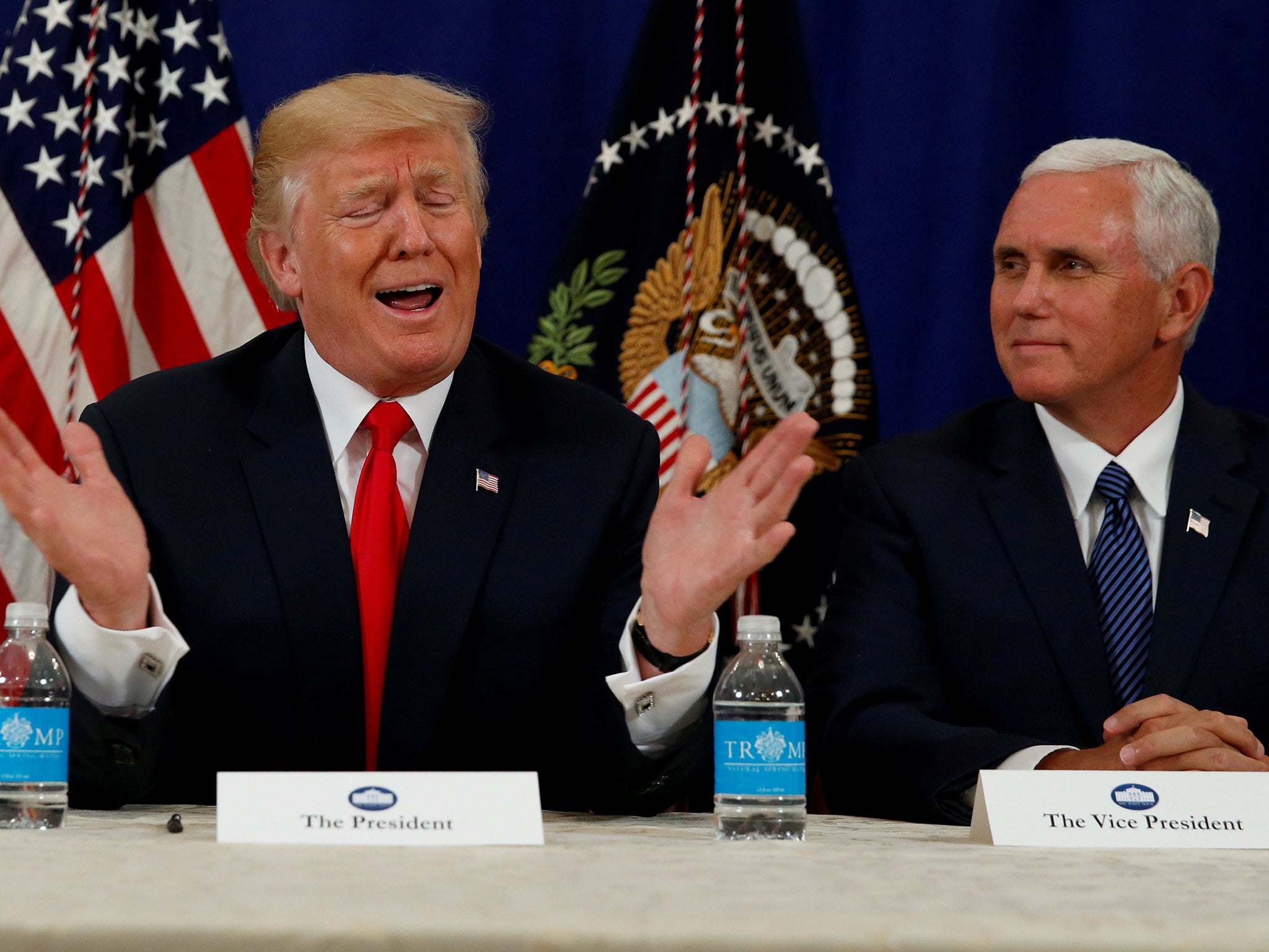 US President Donald Trump with Vice President Mike Pence speaking to reporters following a security briefing