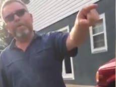 Woman confronts man flying Nazi flag from home