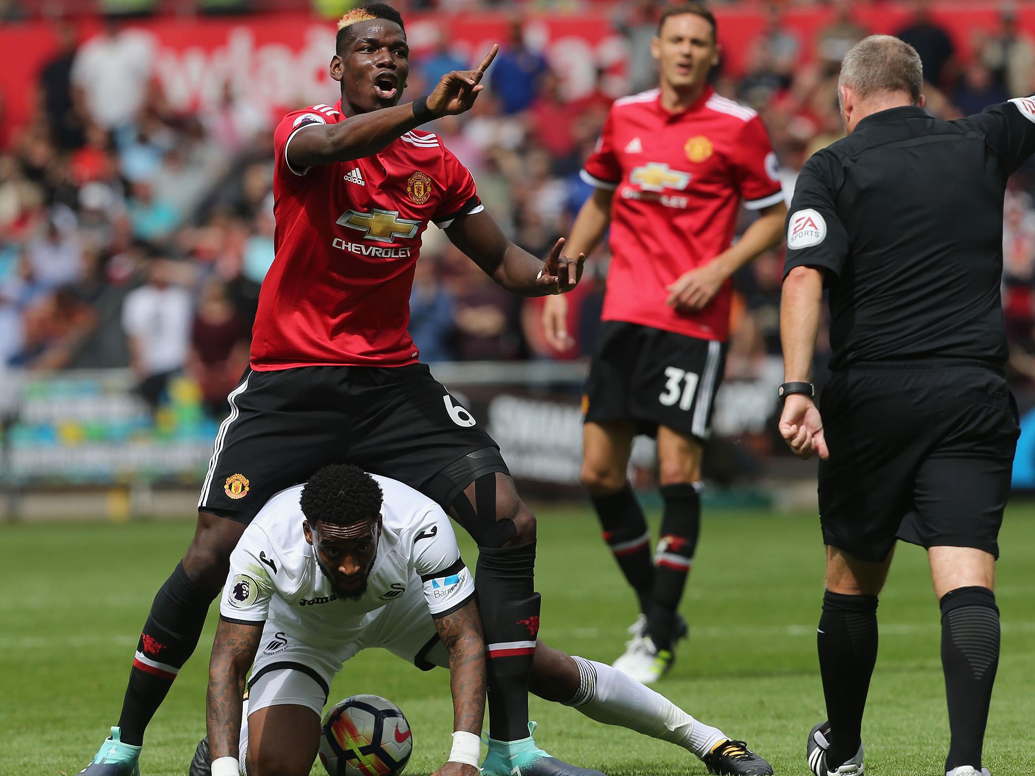 Paul Pogba appeals against receiving a booking after fouling Leroy Fer in Manchester United's win over Swansea