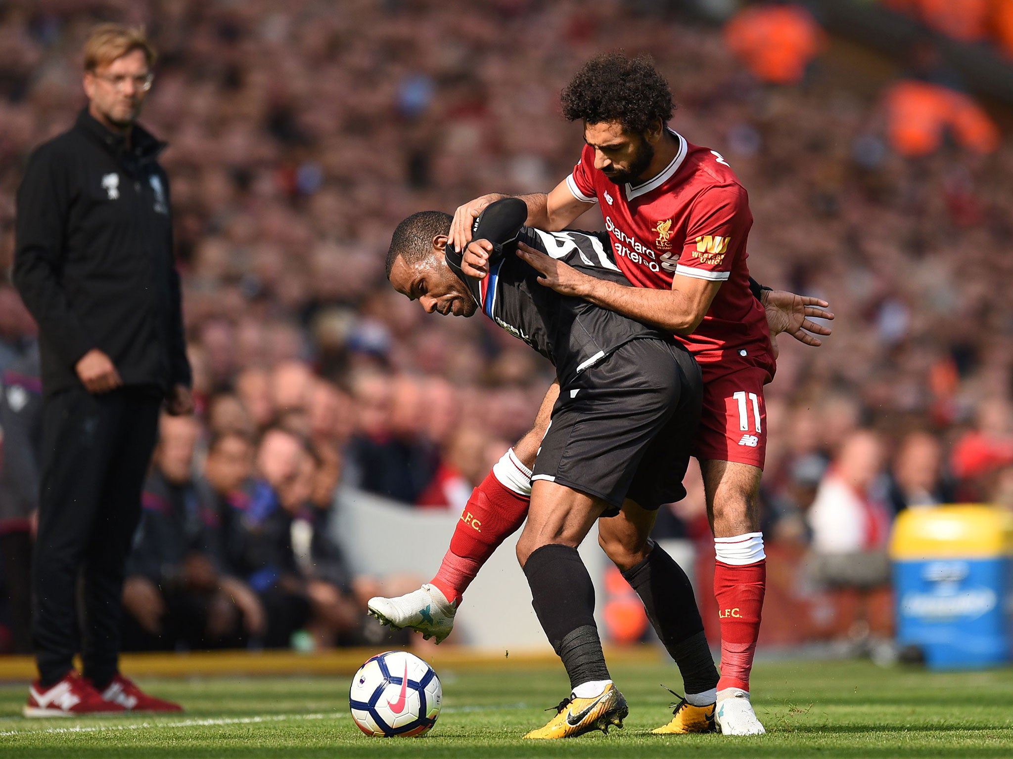 Jurgen Klopp watches on as Mohamed Salah attempts to dispossess Jason Puncheon