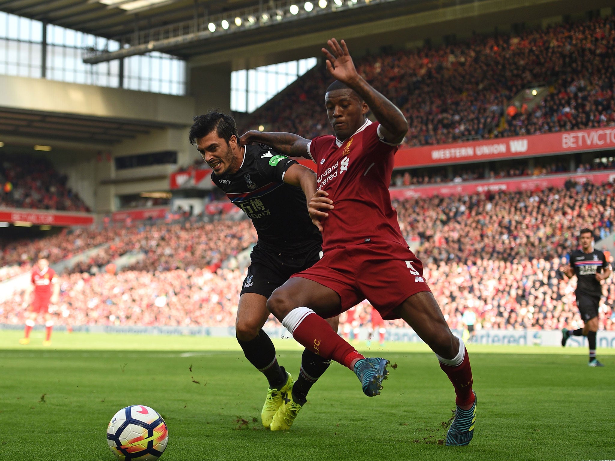 James Tomkins and Georginio Wijnaldum tussle for possession