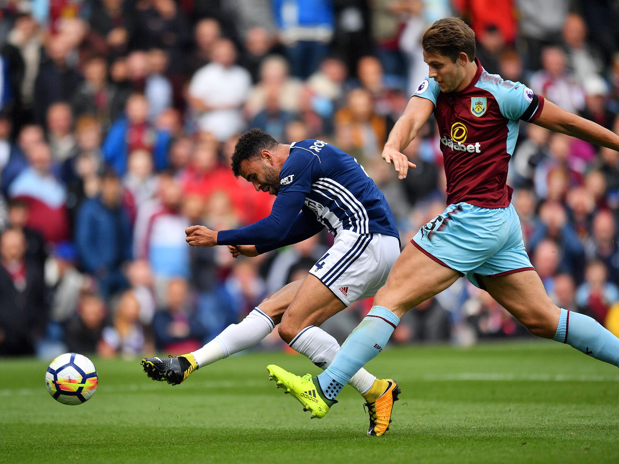 Robson-Kanu shoots the ball past Burnley goalkeeper Tom Heaton